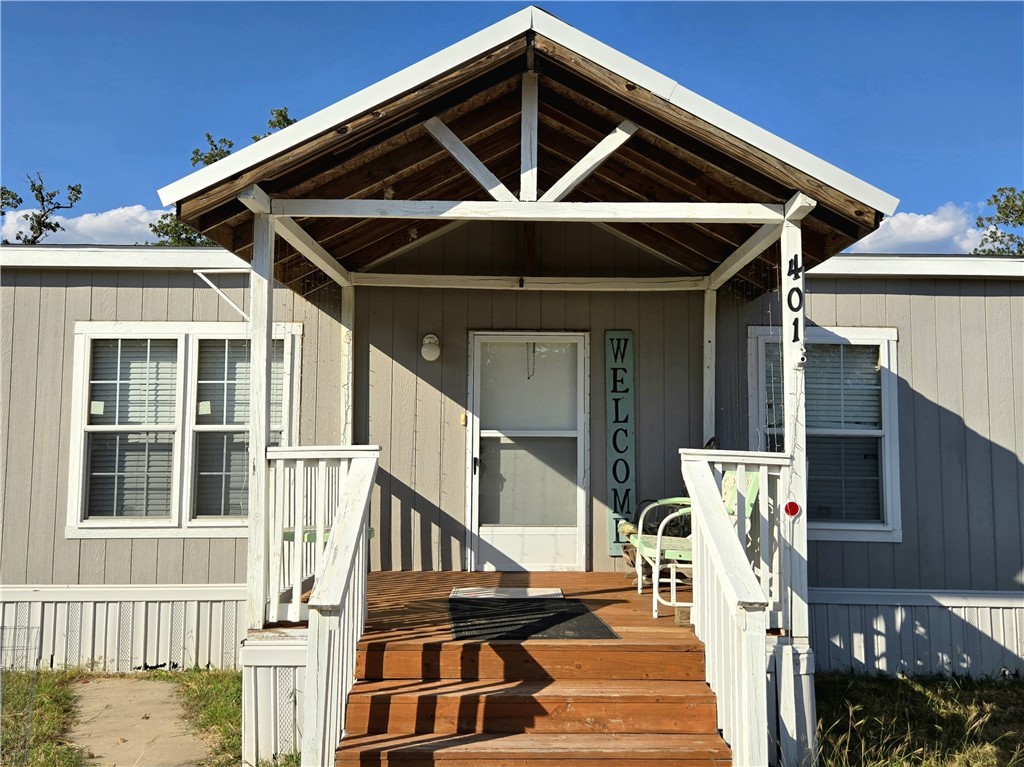 401 Raiders Road Somerville, TX 77879 - Photo 11 of 30 a front view of a house with a yard