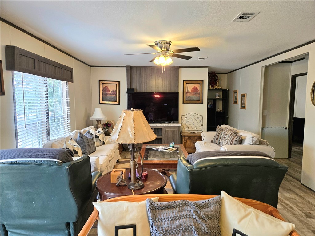 401 Raiders Road Somerville, TX 77879 - Photo 18 of 30 a living room with furniture and wooden floor