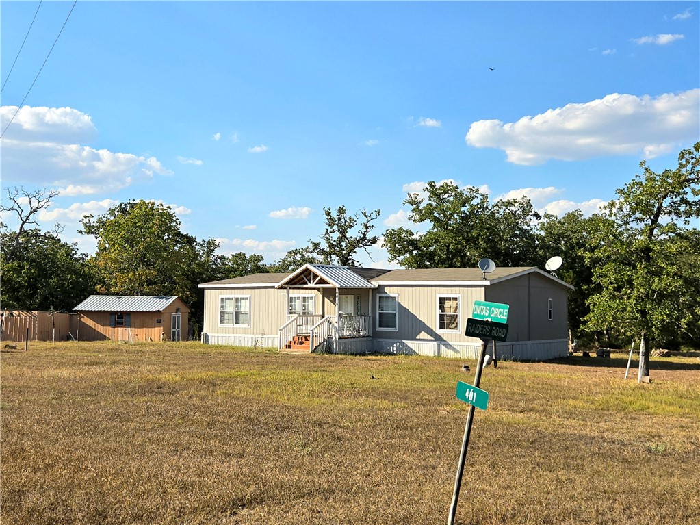 401 Raiders Road Somerville, TX 77879 - Photo 2 of 30 a house view with a backyard space