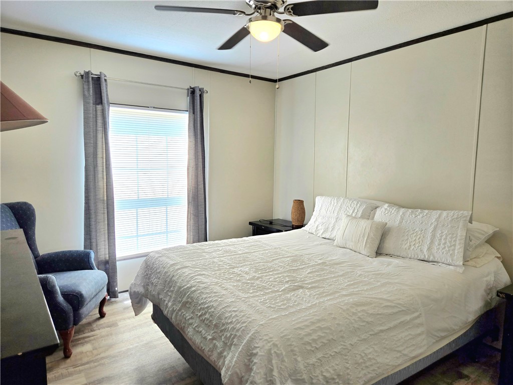 401 Raiders Road Somerville, TX 77879 - Photo 22 of 30 a bedroom with a bed and furniture