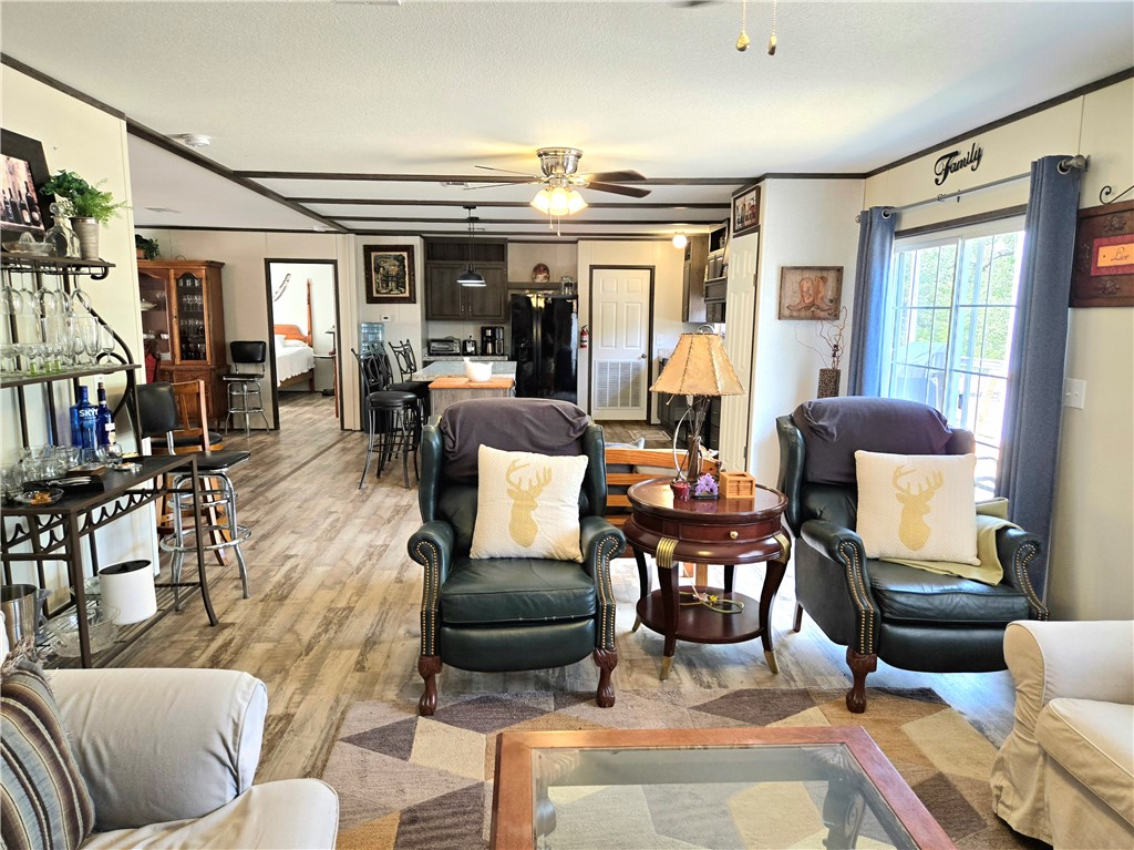 401 Raiders Road Somerville, TX 77879 - Photo 25 of 30 a living room with furniture and a large window