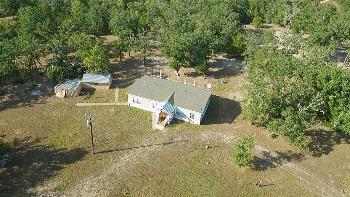 401 Raiders Road Somerville, TX 77879 - Photo 27 of 30 an aerial view of a house with a yard and lake view