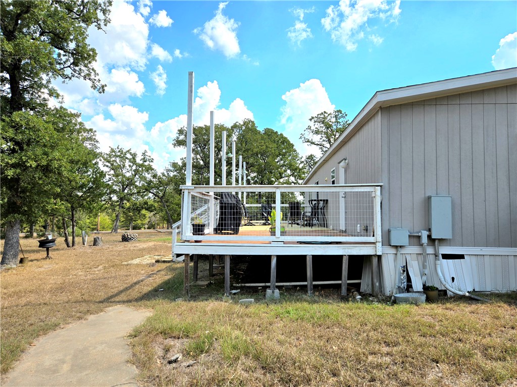 401 Raiders Road Somerville, TX 77879 - Photo 4 of 30 a view of a house with backyard and sitting area