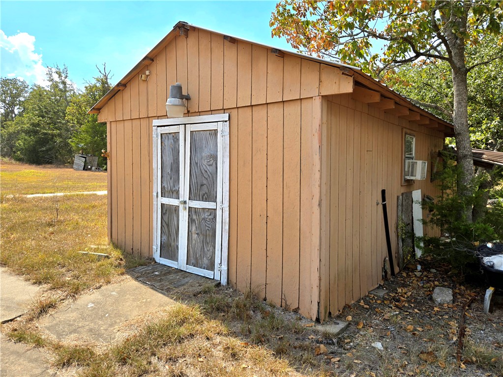 401 Raiders Road Somerville, TX 77879 - Photo 9 of 30 a view of a house with backyard and garden