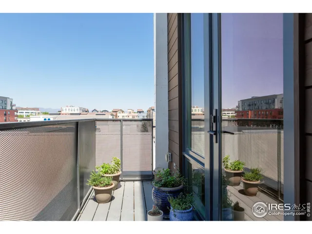a view of a balcony with chair and table