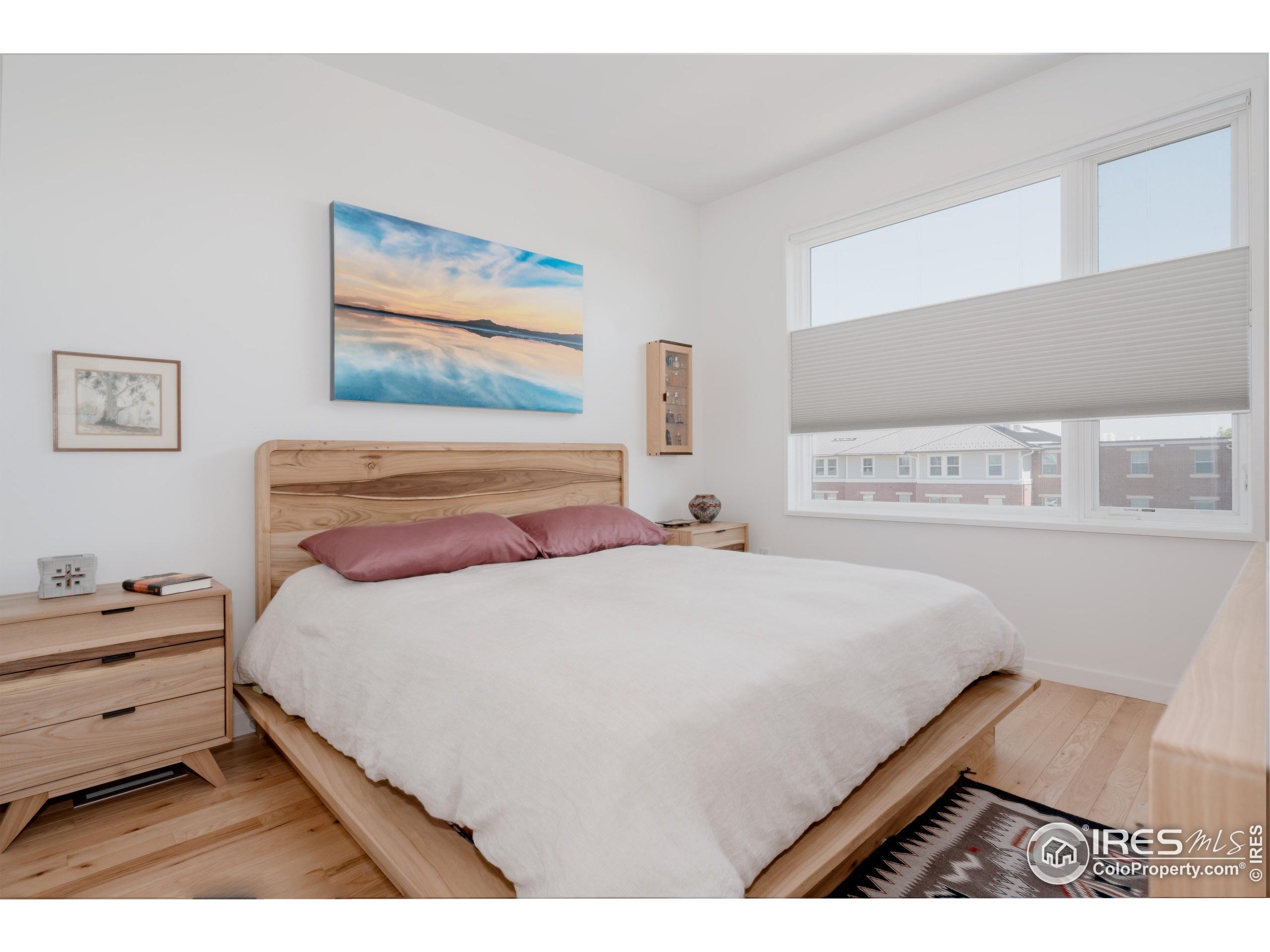 401 Linden Street, Unit 3336 Fort Collins, CO 80524 - Photo 16 of 38 a bedroom with a bed and a painting on the wall