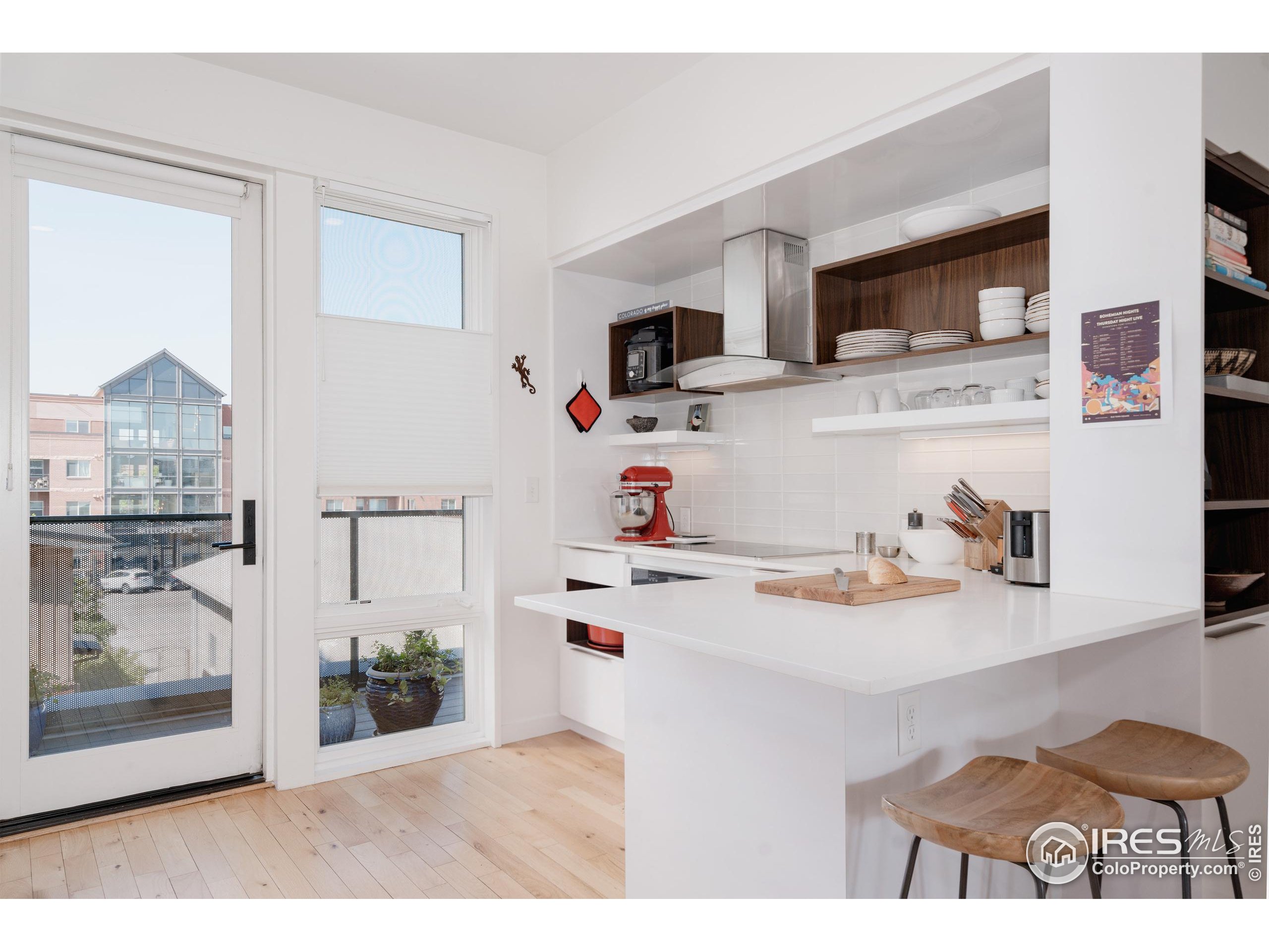401 Linden Street, Unit 3336 Fort Collins, CO 80524 - Photo 2 of 38 a kitchen with stainless steel appliances a sink and a refrigerator