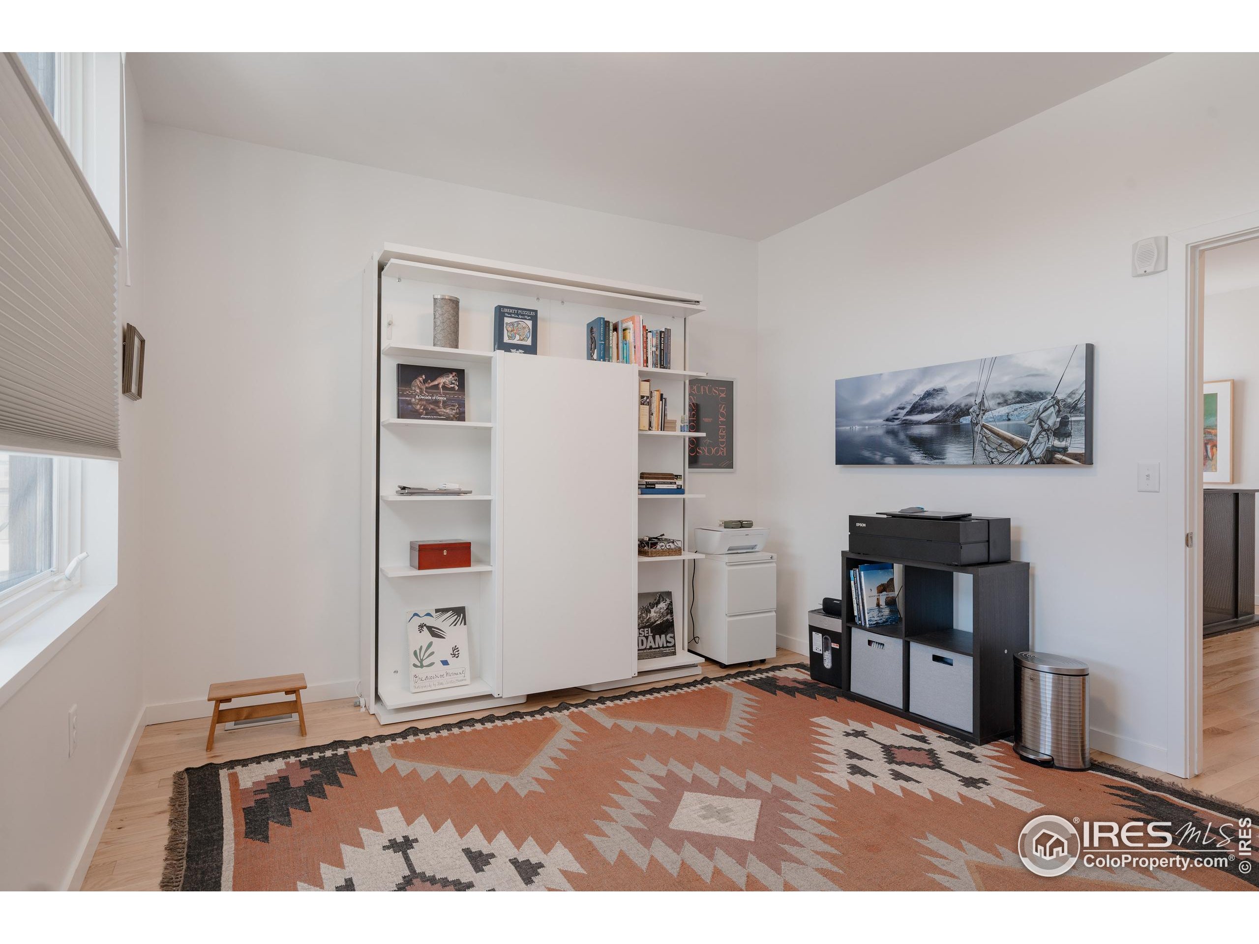 401 Linden Street, Unit 3336 Fort Collins, CO 80524 - Photo 21 of 38 a bedroom with a bed and a bookshelf