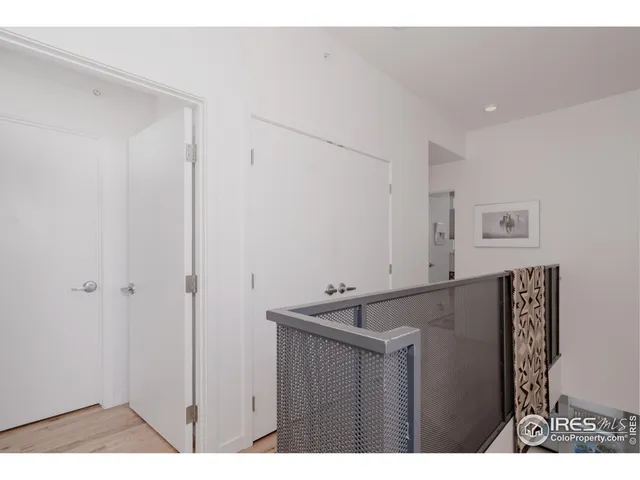 a kitchen view with cabinets and a refrigerator