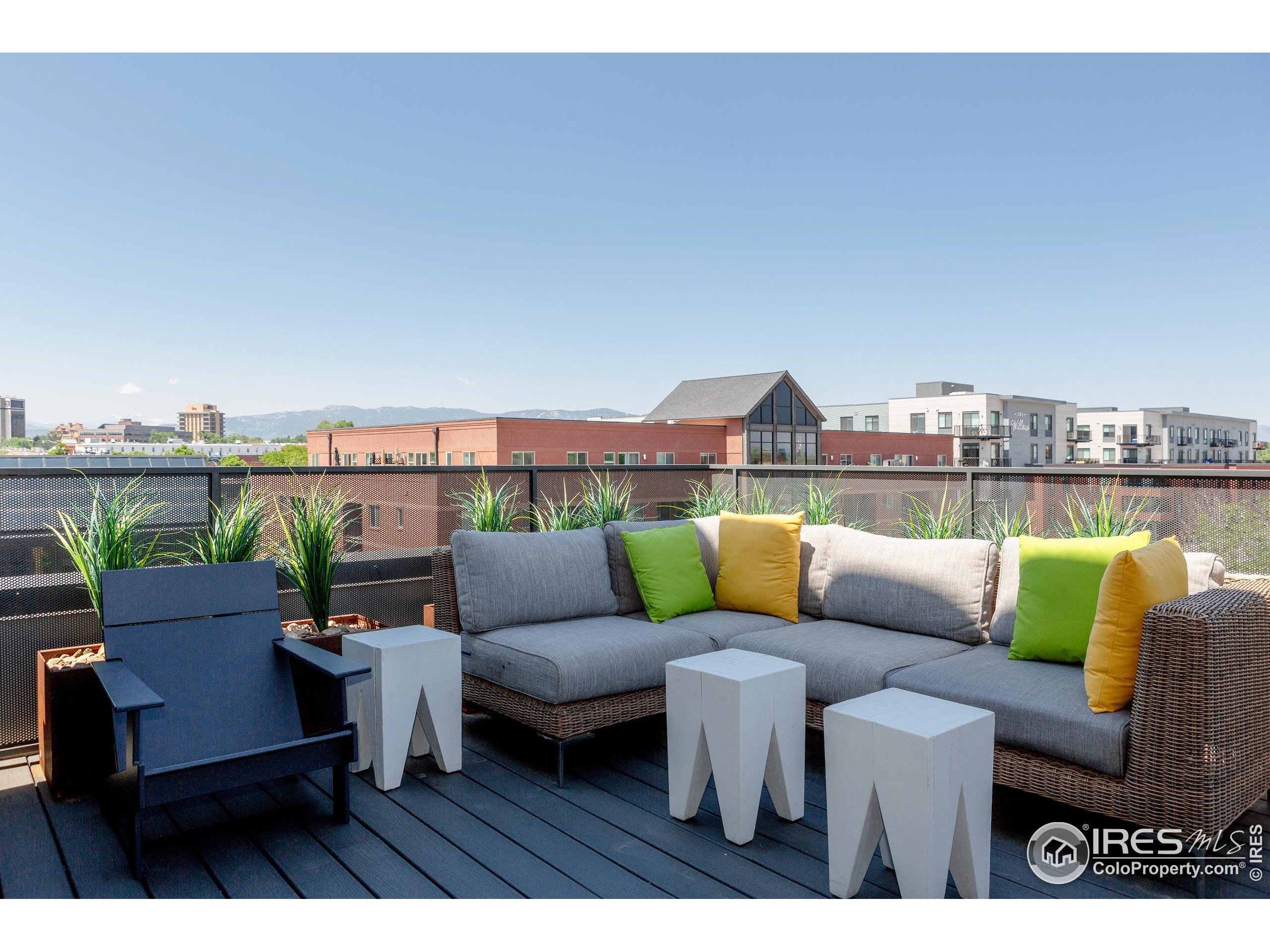 401 Linden Street, Unit 3336 Fort Collins, CO 80524 - Photo 29 of 38 a roof deck with a table and chairs
