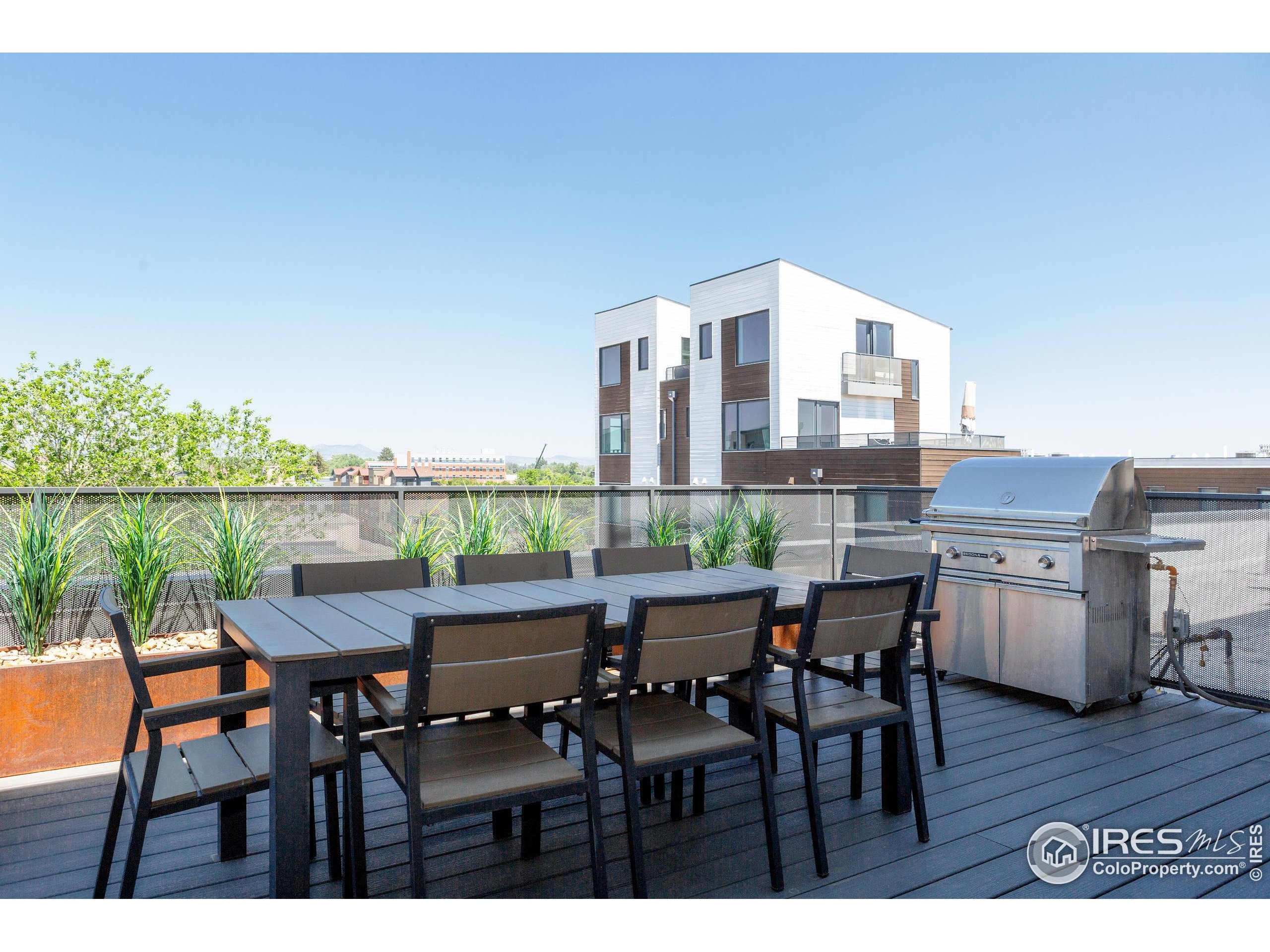401 Linden Street, Unit 3336 Fort Collins, CO 80524 - Photo 30 of 38 a view of a dining room with furniture and wooden floor