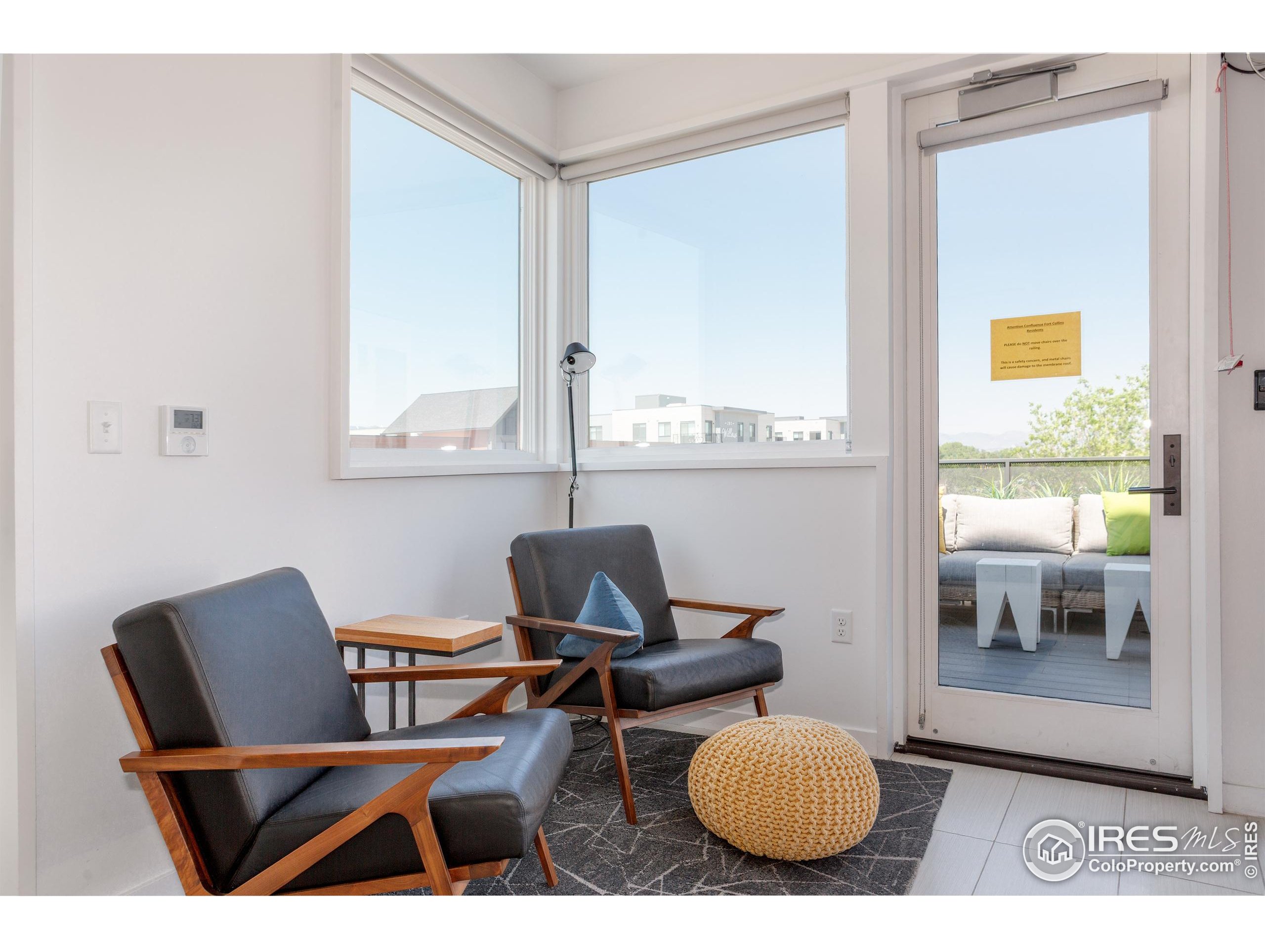401 Linden Street, Unit 3336 Fort Collins, CO 80524 - Photo 34 of 38 a living room with furniture and a window