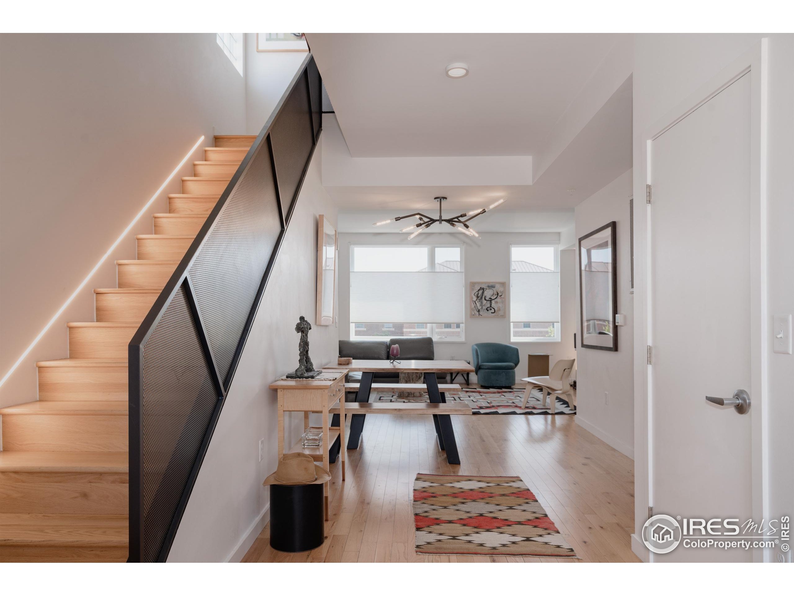 401 Linden Street, Unit 3336 Fort Collins, CO 80524 - Photo 7 of 38 a living room with furniture and wooden floor