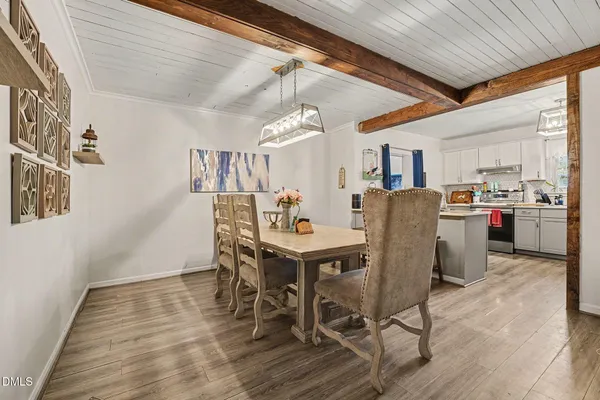 a kitchen with a sink and a stove top oven