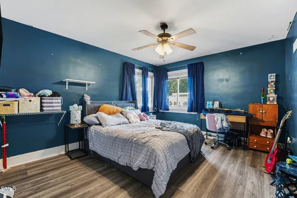 a bathroom with a sink toilet and window