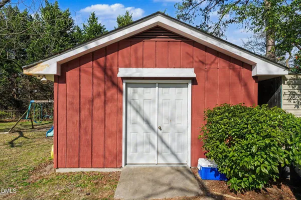 a patio with a yard table and chairs