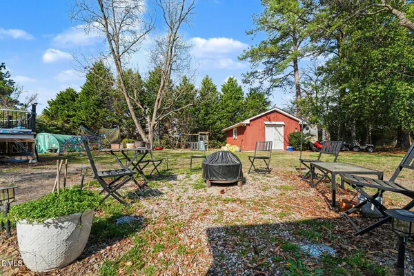 a backyard of a house with lots of green space