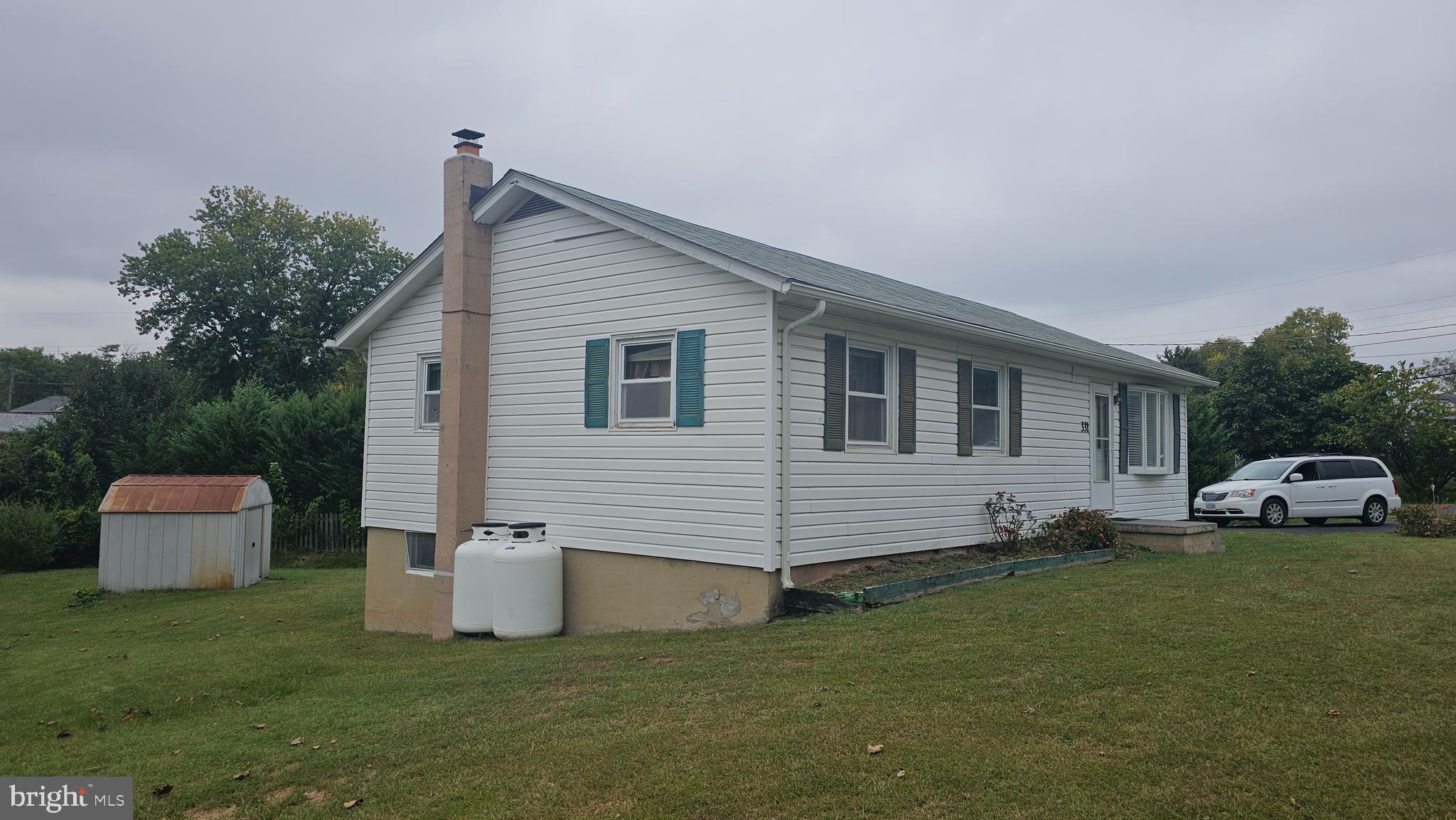 331 Dogwood Road Winchester, VA 22602 - Photo 5 of 16 a front view of a house with a garden