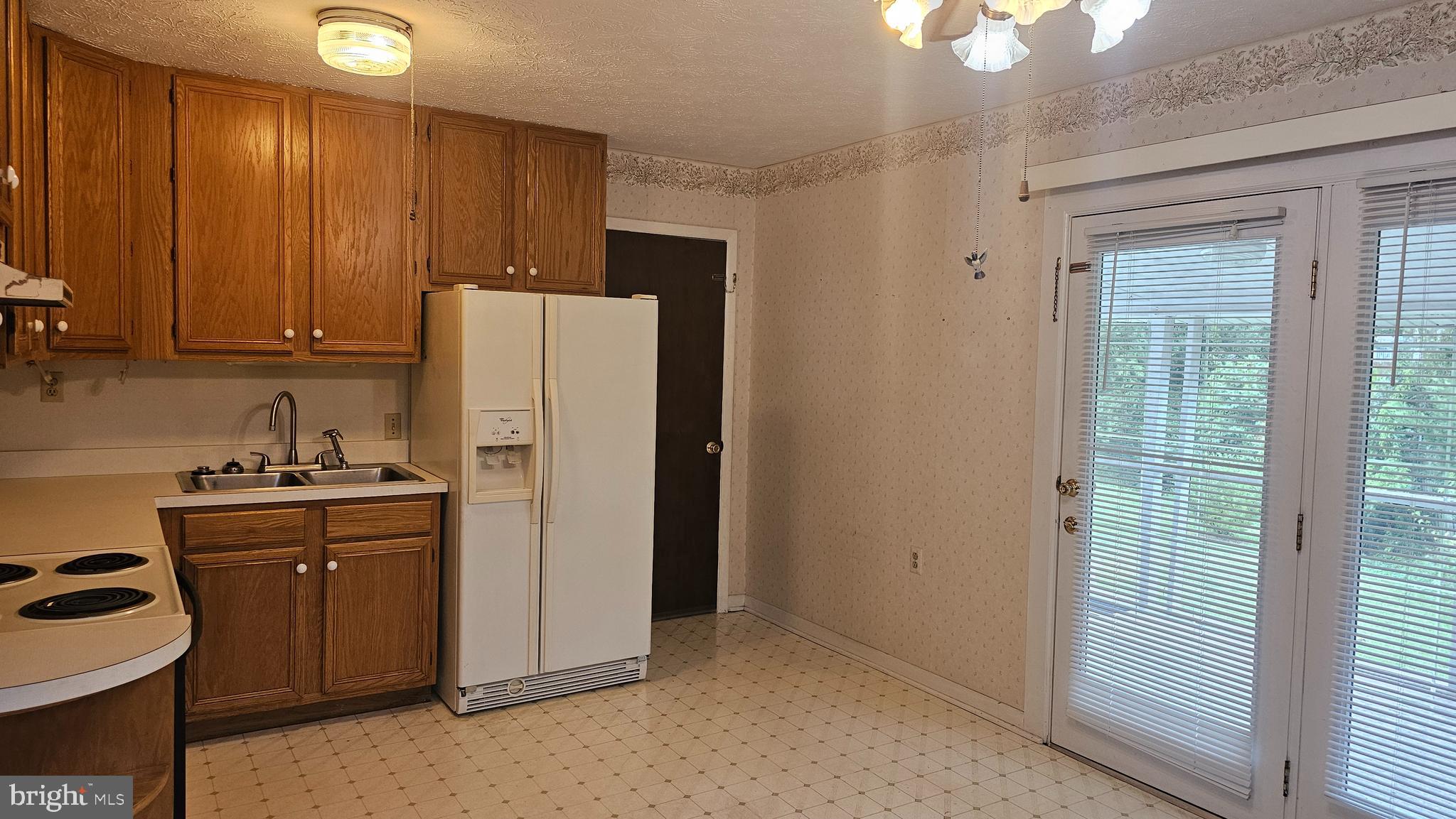 331 Dogwood Road Winchester, VA 22602 - Photo 6 of 16 a kitchen with a refrigerator and a sink