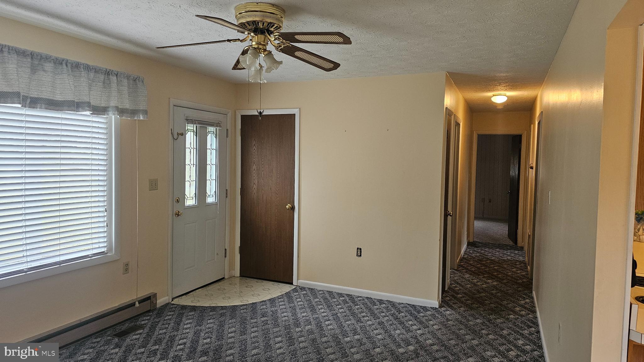 331 Dogwood Road Winchester, VA 22602 - Photo 7 of 16 a view of a hallway with a chandelier fan