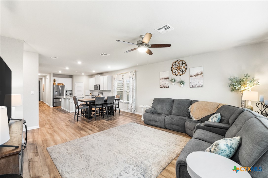 232 Colebrook Way Cibolo, TX 78108 - Photo 16 of 42 a living room with furniture and kitchen view