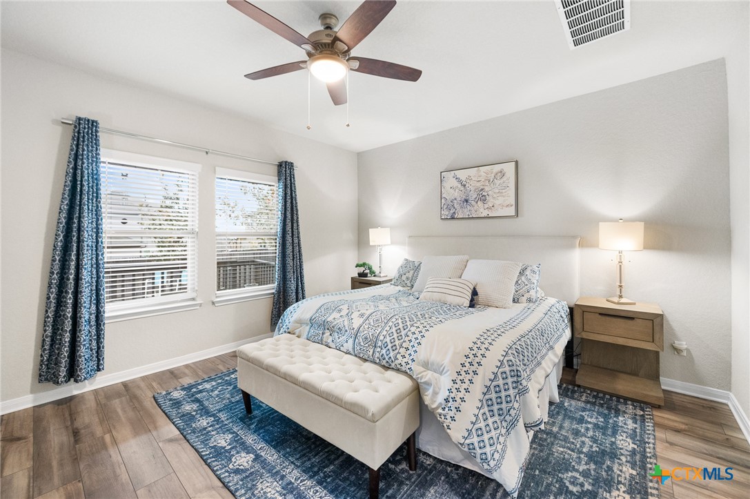 232 Colebrook Way Cibolo, TX 78108 - Photo 17 of 42 a spacious bedroom with a large bed and a window