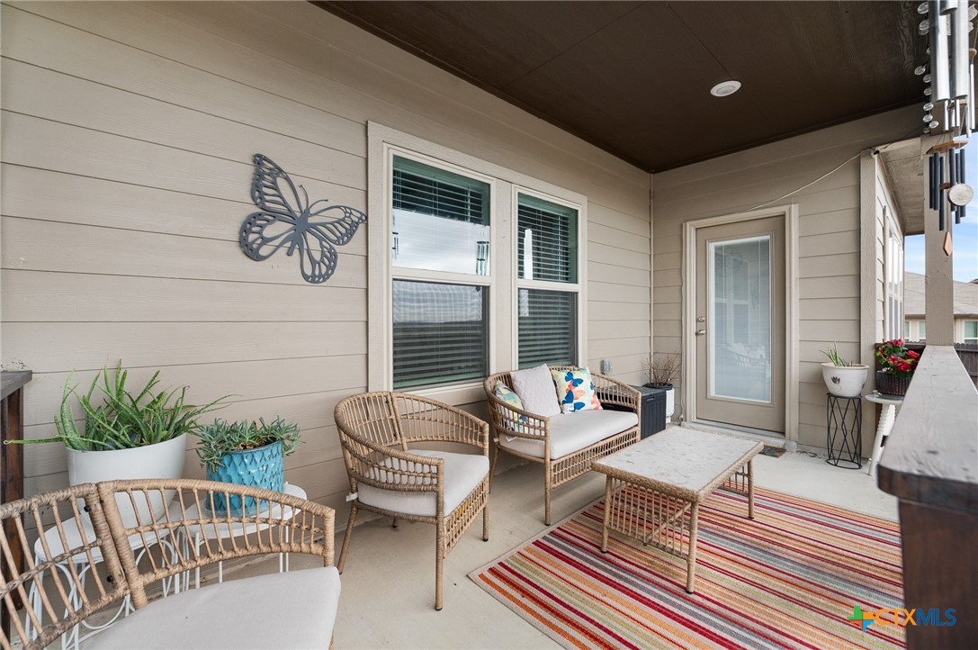 232 Colebrook Way Cibolo, TX 78108 - Photo 39 of 42 a outdoor living space with furniture and a potted plant