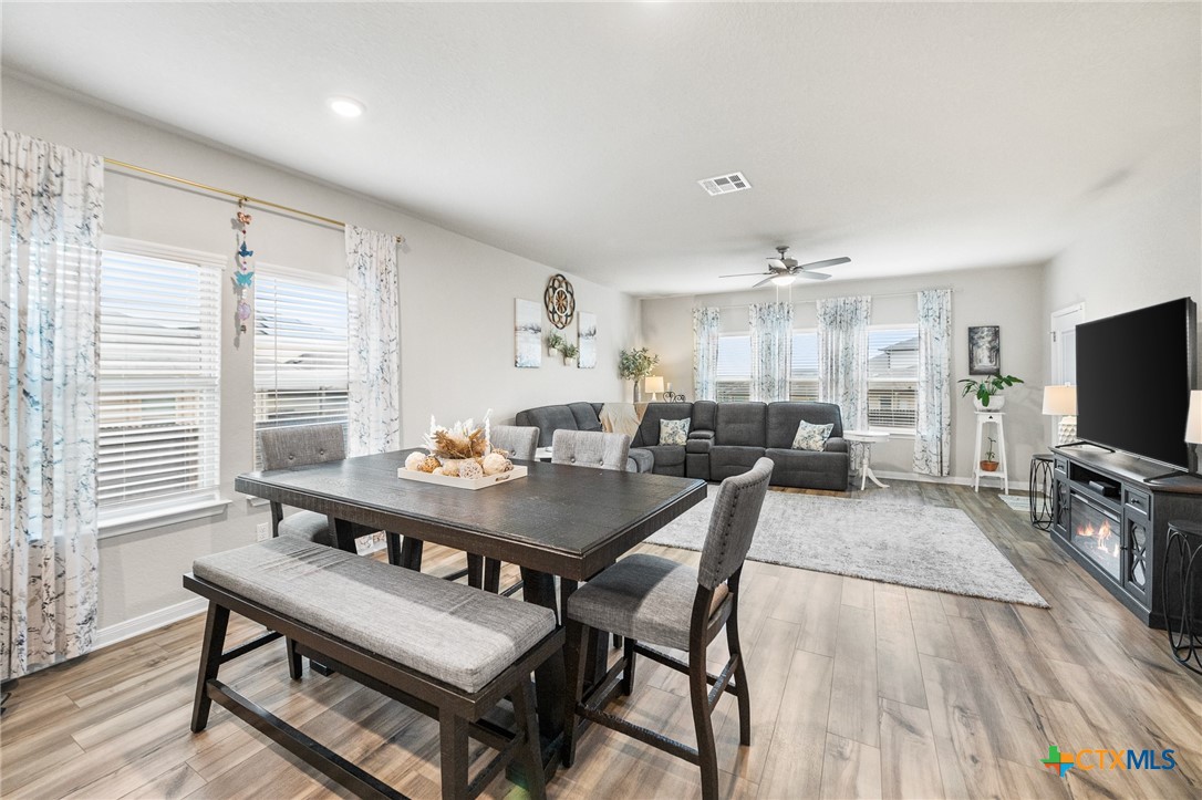 232 Colebrook Way Cibolo, TX 78108 - Photo 10 of 42 a view of a dining room with furniture and wooden floor