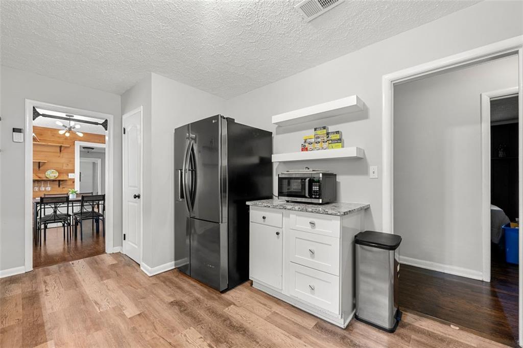 2268 Shamrock Drive Decatur, GA 30032 - Photo 13 of 31 a kitchen with stainless steel appliances a refrigerator stove and sink