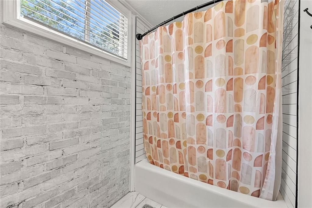 2268 Shamrock Drive Decatur, GA 30032 - Photo 17 of 31 a bathroom with a shower curtain