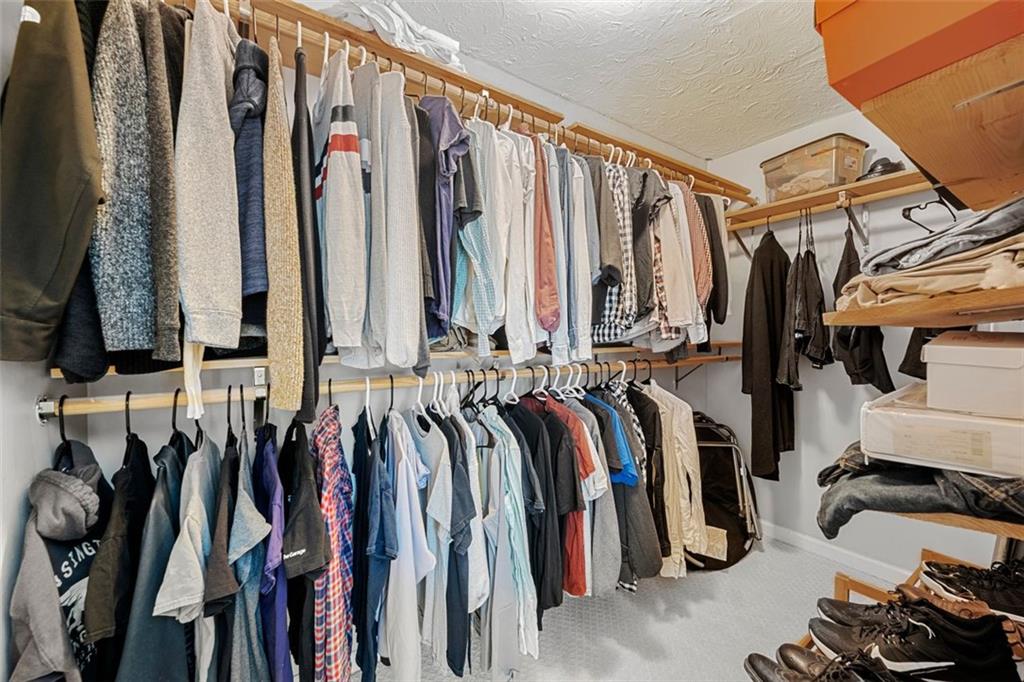 2268 Shamrock Drive Decatur, GA 30032 - Photo 19 of 31 a view of walk in closet with clothes and shoes