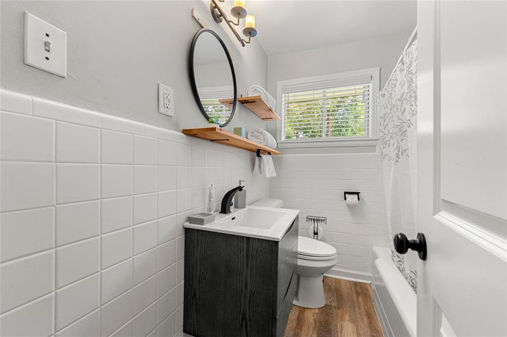 2268 Shamrock Drive Decatur, GA 30032 - Photo 22 of 31 a bathroom with a sink a toilet and a mirror