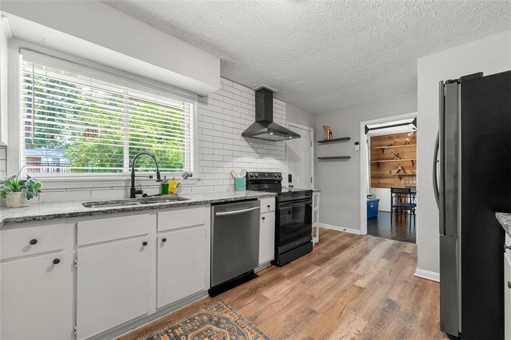 2268 Shamrock Drive Decatur, GA 30032 - Photo 3 of 31 a kitchen with a sink stove and refrigerator