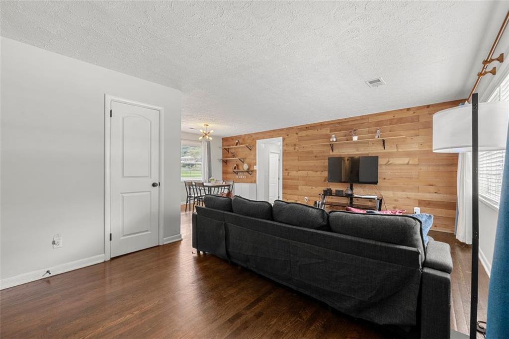 2268 Shamrock Drive Decatur, GA 30032 - Photo 8 of 31 a living room with furniture and a flat screen tv
