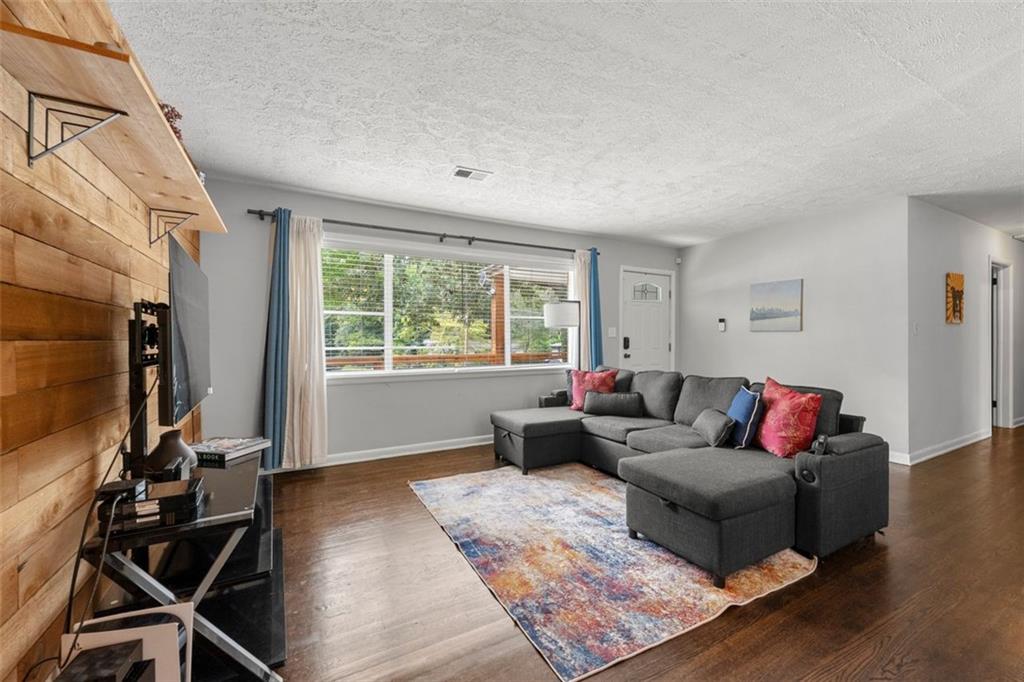 2268 Shamrock Drive Decatur, GA 30032 - Photo 9 of 31 a living room with furniture and a flat screen tv