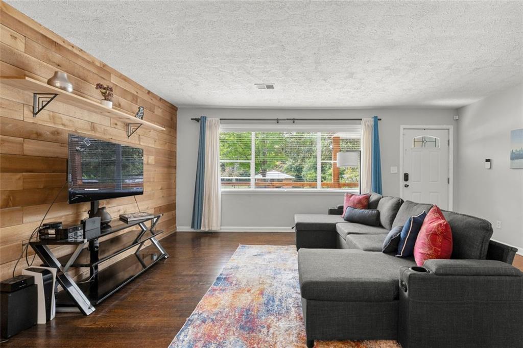2268 Shamrock Drive Decatur, GA 30032 - Photo 10 of 31 a living room with furniture and a flat screen tv