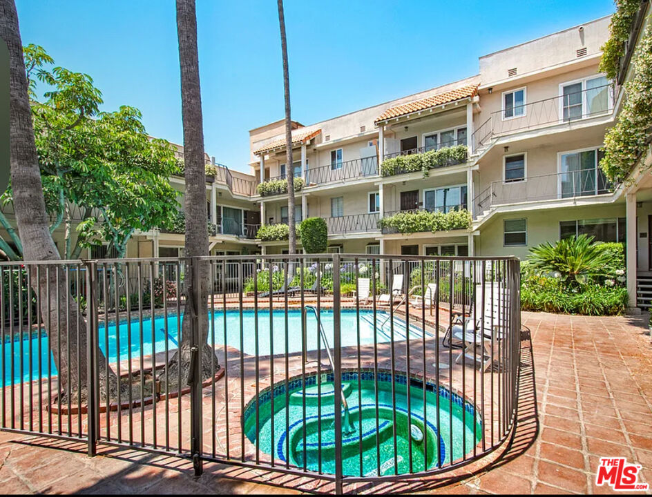 11670 Sunset Boulevard, Unit 303 Los Angeles, CA 90049 - Photo 25 of 32 a view of a brick building from a balcony
