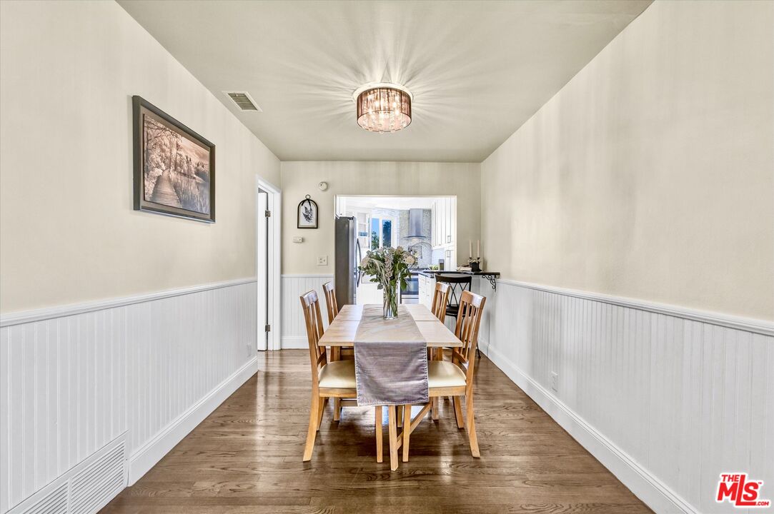 11670 Sunset Boulevard, Unit 303 Los Angeles, CA 90049 - Photo 9 of 32 a view of a dining room with furniture window and wooden floor