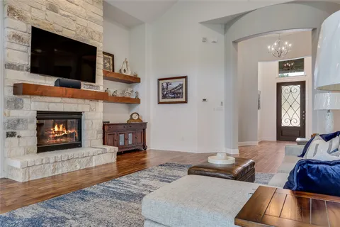 a living room with furniture and a fireplace or television