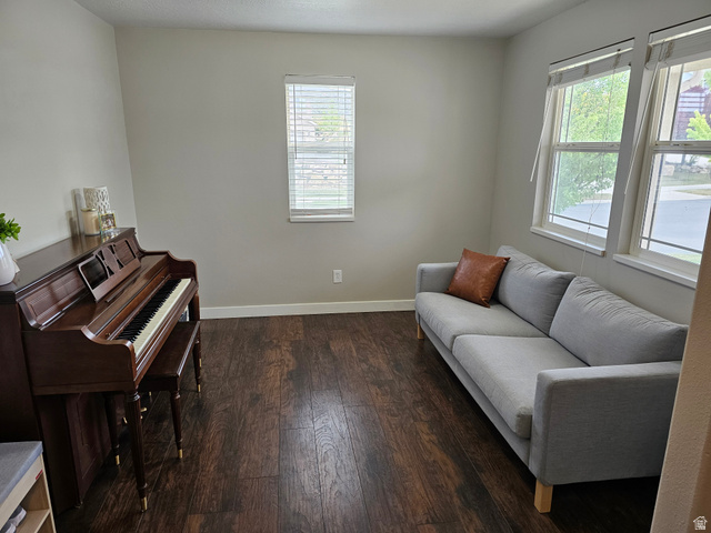 7481 Red Pine Road Eagle Mountain, UT 84005 - Photo 3 of 38 Spacious formal livingroom featuring wood-finish flooring, neutral wall tones, and multiple windows with blinds