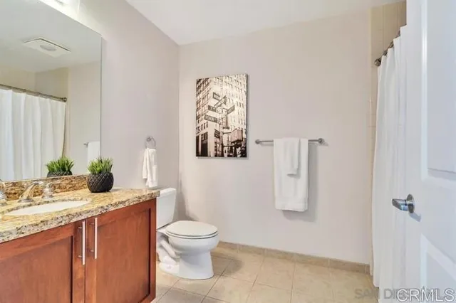 a view of a room with wooden floor and a window