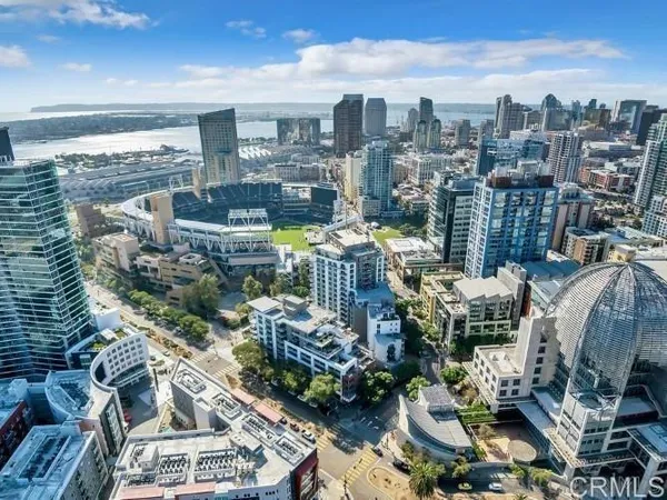 a view of multiple houses with a street