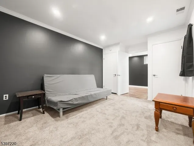 a living room with furniture and a rug