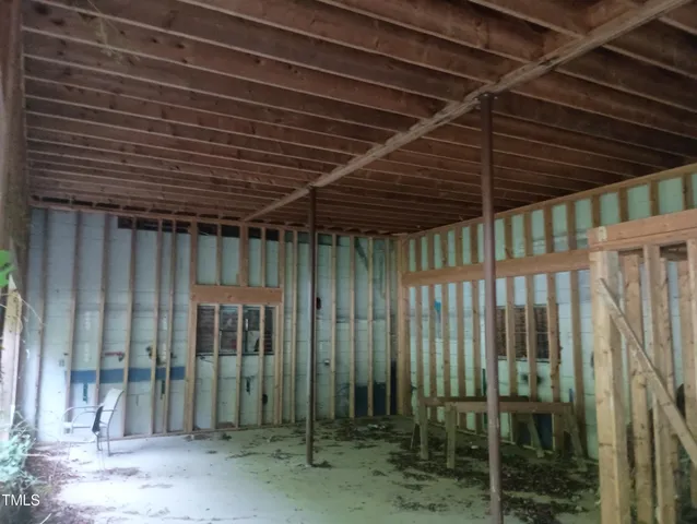 a view of backyard with porch