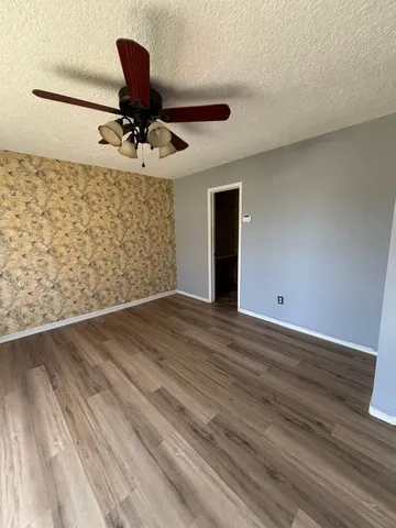 a view of a livingroom with wooden floor