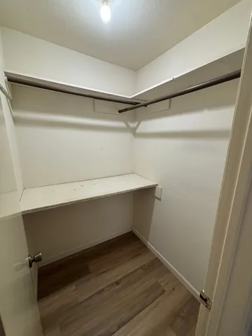 a view of an empty walk in closet
