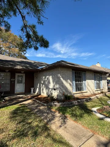 a front view of a house with garage