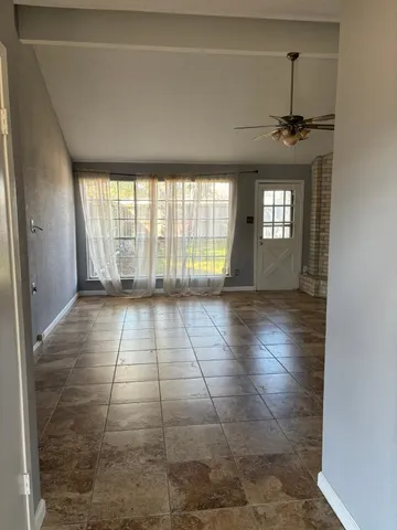 a view of an empty room and window