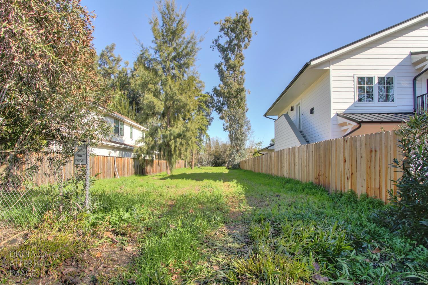 1136 Los Robles Street Davis, CA 95618 - Photo 6 of 11 a view of a backyard with potted plants and large tree