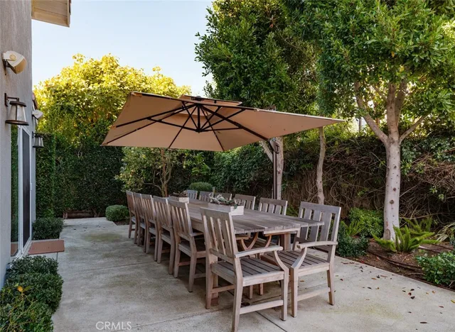 a view of an outdoor space with a table and chairs